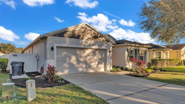 view of front of home with a garage and a front lawn