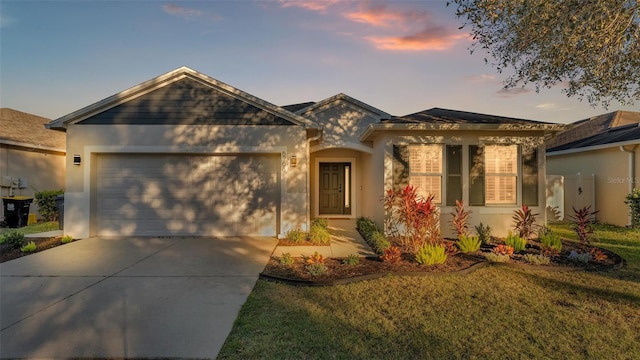 single story home with stucco siding, a garage, and concrete driveway