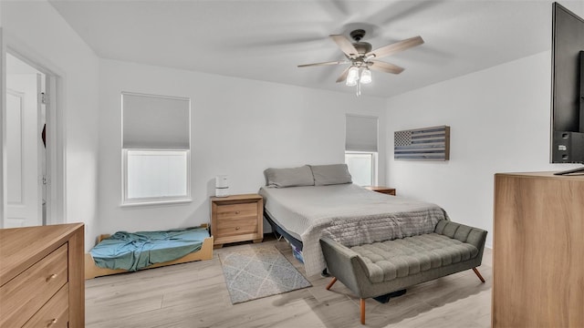 bedroom featuring a ceiling fan and light wood-style floors