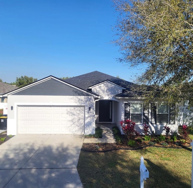 ranch-style home with a garage and concrete driveway