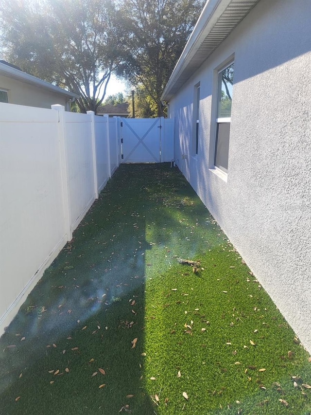 view of yard with a gate and fence