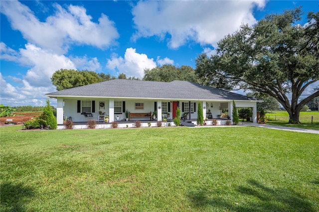 single story home featuring covered porch and a front lawn