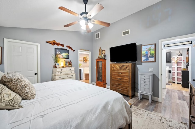 bedroom featuring vaulted ceiling, ceiling fan, and light hardwood / wood-style floors