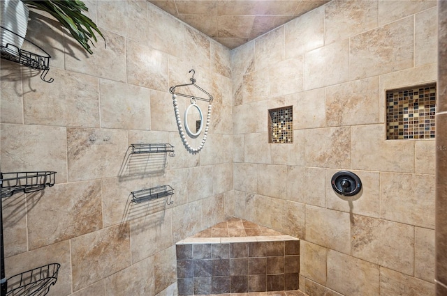 bathroom featuring a tile shower