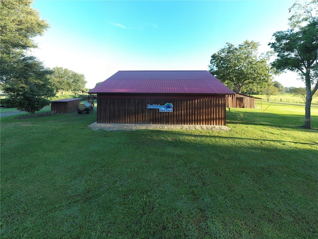 view of outdoor structure with a yard