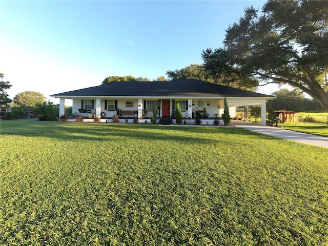 single story home with a carport, covered porch, and a front yard