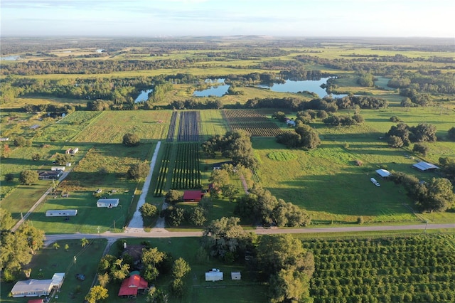 aerial view with a water view and a rural view