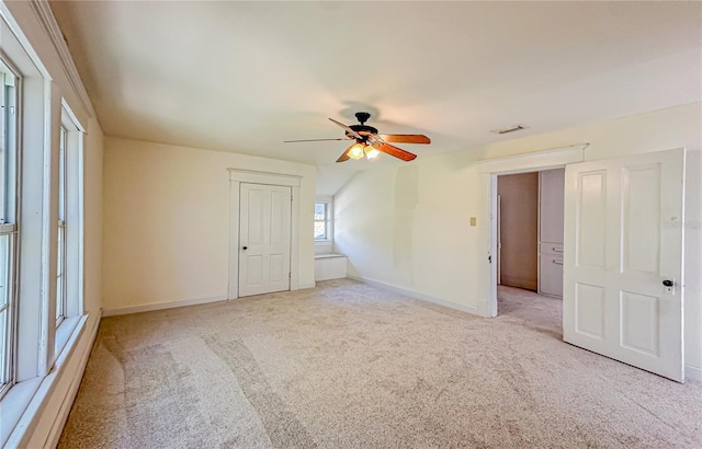 carpeted empty room with ceiling fan