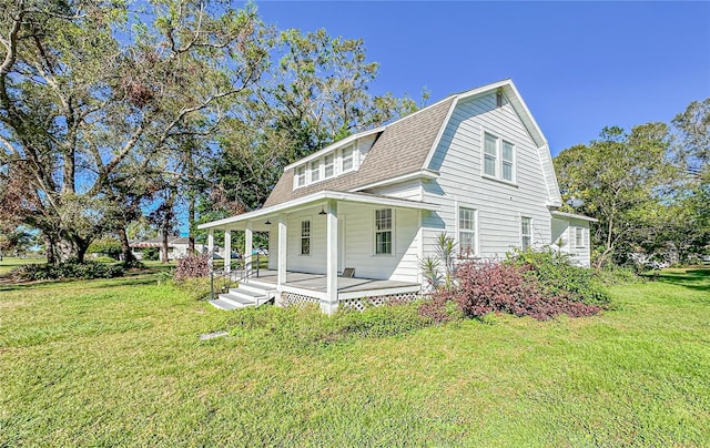 exterior space featuring a yard and a porch