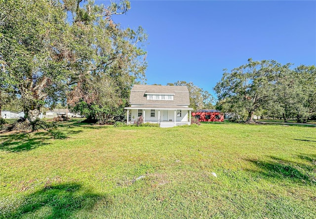 view of yard featuring covered porch