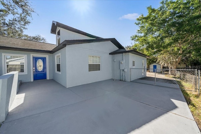 back of property with a patio area