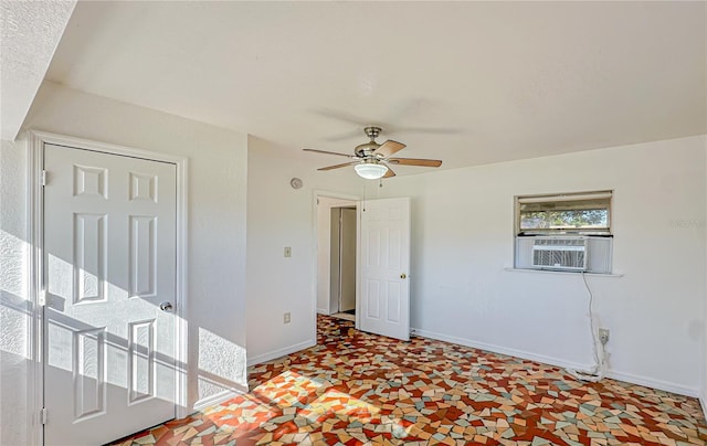 unfurnished room with ceiling fan and cooling unit