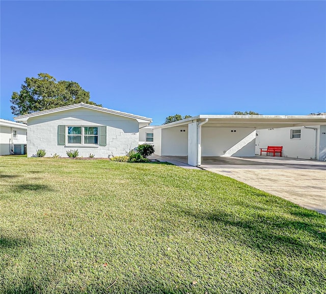 ranch-style home with central AC, a front yard, and a carport