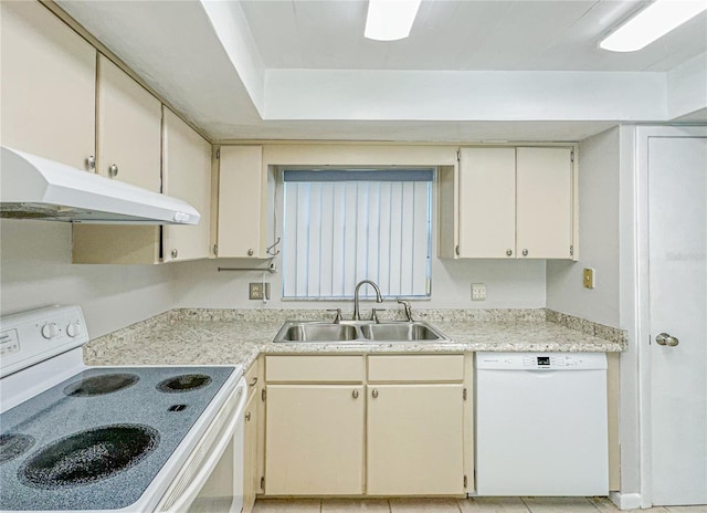 kitchen featuring cream cabinets, sink, light tile patterned flooring, and white appliances