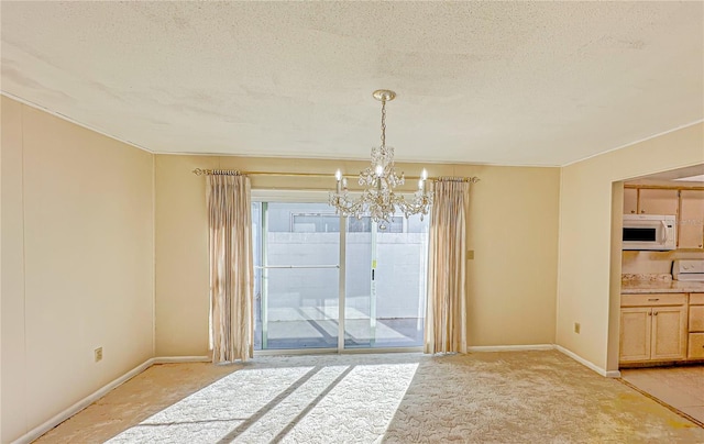 unfurnished dining area featuring light carpet, a textured ceiling, and a notable chandelier