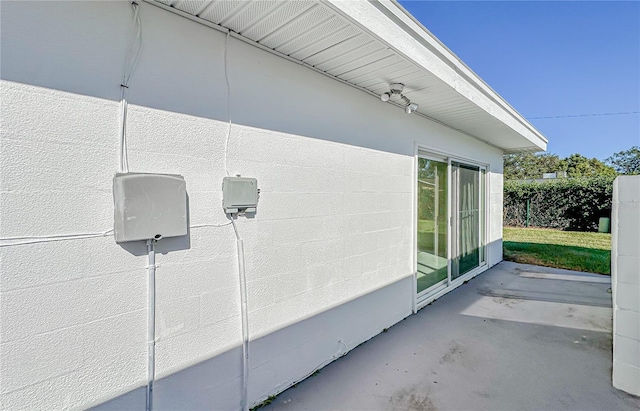 view of side of home featuring a patio area