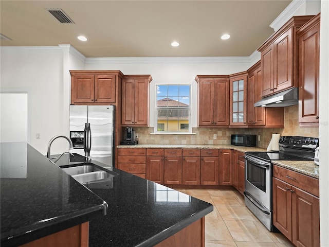 kitchen with sink, dark stone countertops, ornamental molding, tasteful backsplash, and stainless steel appliances