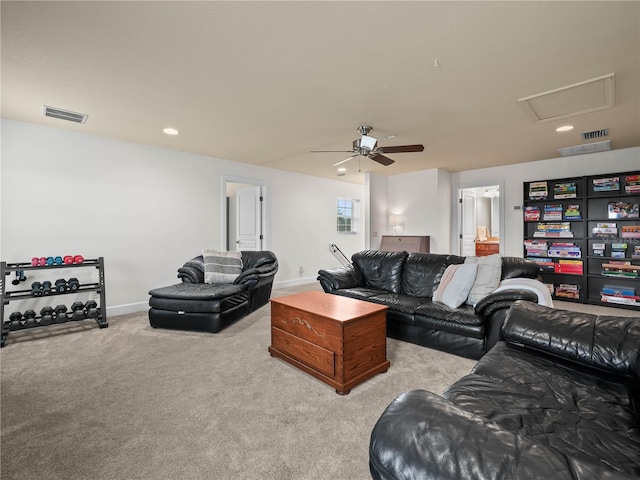 carpeted living room with ceiling fan