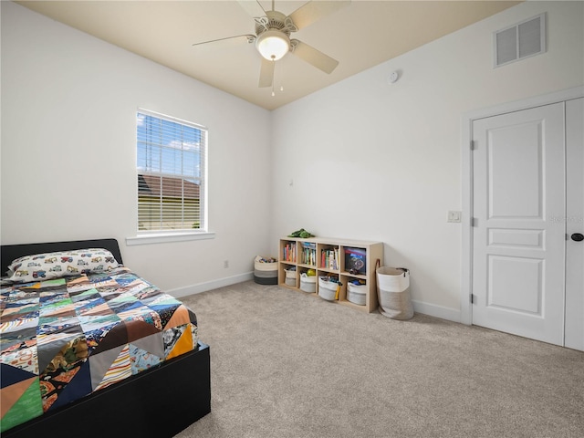 carpeted bedroom with a closet and ceiling fan