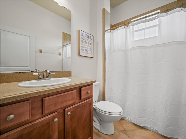 bathroom with tile patterned floors, vanity, and toilet