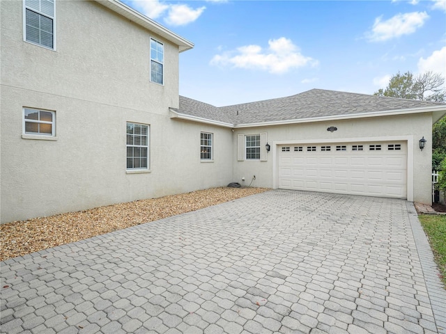 view of property exterior featuring a garage