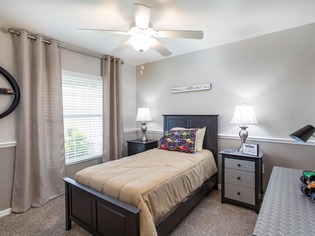 carpeted bedroom featuring ceiling fan