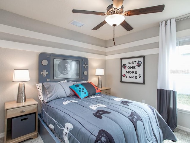 carpeted bedroom featuring ceiling fan