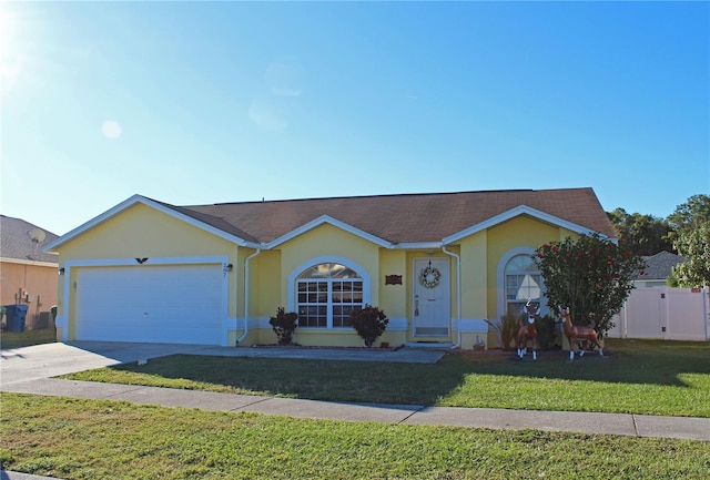 ranch-style home featuring a front yard and a garage