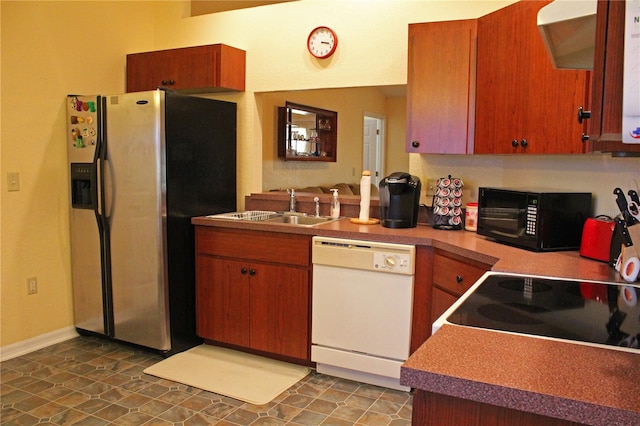 kitchen with stainless steel fridge, stove, white dishwasher, and sink