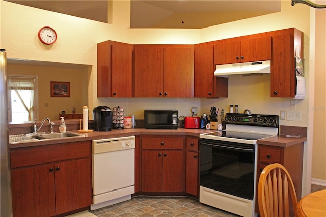 kitchen featuring white appliances and sink