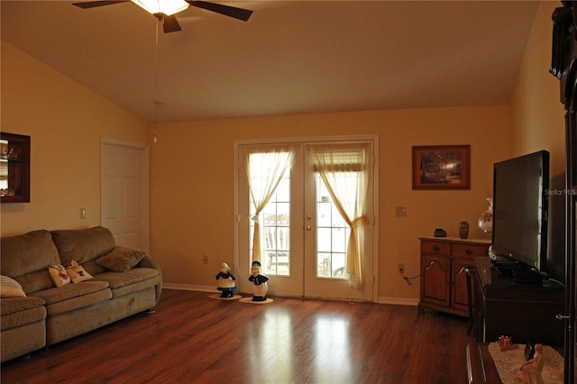 living room with vaulted ceiling, ceiling fan, french doors, and dark hardwood / wood-style floors