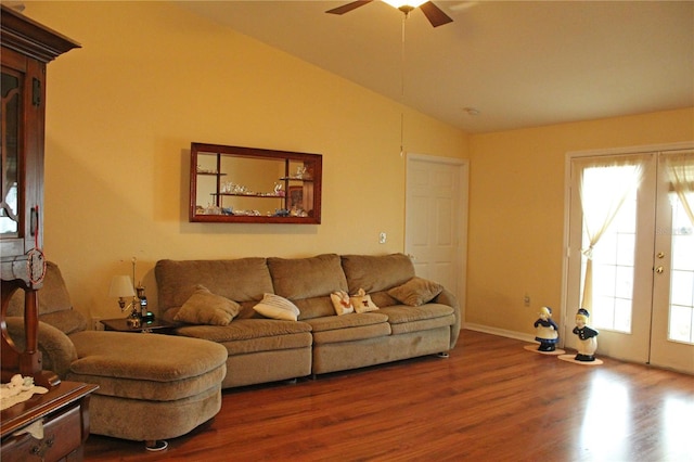 living room with hardwood / wood-style floors, french doors, lofted ceiling, and ceiling fan