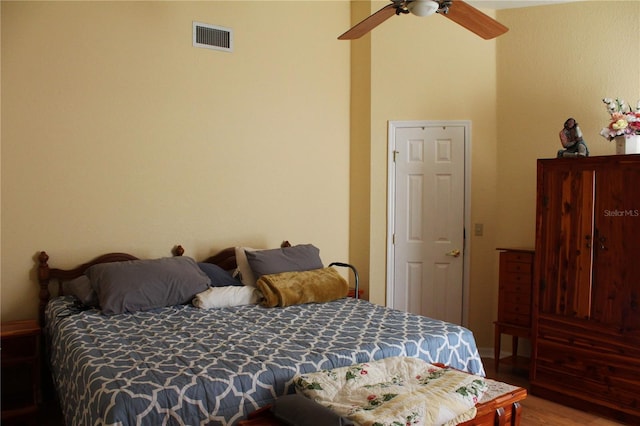 bedroom featuring hardwood / wood-style flooring and ceiling fan