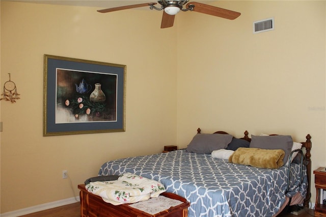 bedroom with ceiling fan and hardwood / wood-style floors