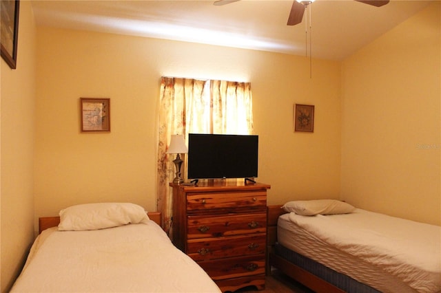 bedroom with ceiling fan and lofted ceiling