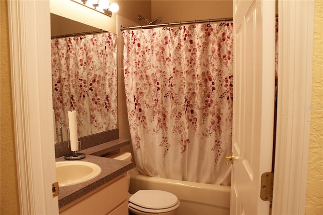 full bathroom featuring shower / bath combination with curtain, vanity, and toilet