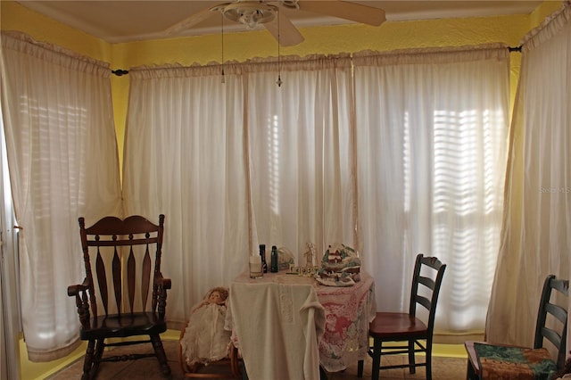 sitting room featuring ceiling fan