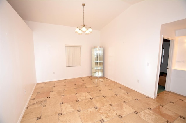 empty room with an inviting chandelier and vaulted ceiling