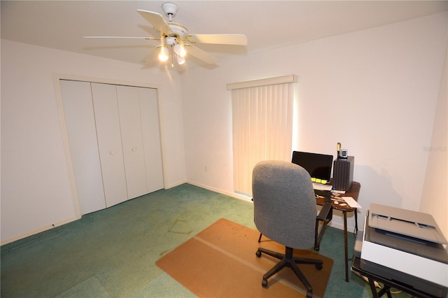 carpeted office space with ceiling fan