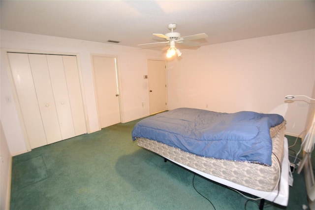 bedroom with dark colored carpet and ceiling fan