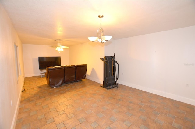 living room featuring ceiling fan with notable chandelier