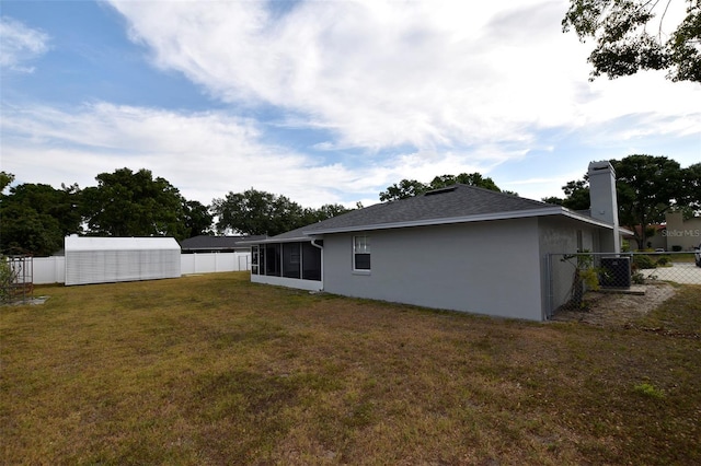 2556 Roslyn Ln, Lakeland, FL 33812 - exterior space featuring a sunroom, a chimney, a fenced backyard, and a lawn