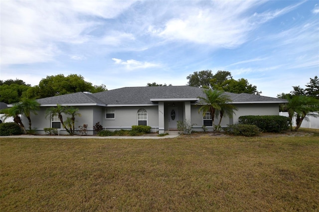 2556 Roslyn Ln, Lakeland, FL 33812 - ranch-style house featuring a front lawn and stucco siding