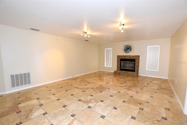 2556 Roslyn Ln, Lakeland, FL 33812 - unfurnished living room with baseboards, visible vents, and a fireplace