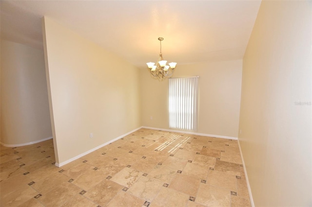 2556 Roslyn Ln, Lakeland, FL 33812 - unfurnished room with baseboards and a chandelier