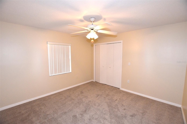 2556 Roslyn Ln, Lakeland, FL 33812 - unfurnished bedroom with carpet floors, a closet, baseboards, and ceiling fan