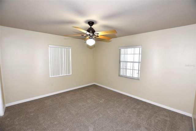 2556 Roslyn Ln, Lakeland, FL 33812 - unfurnished room featuring dark colored carpet, baseboards, and ceiling fan
