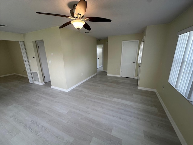 unfurnished room with ceiling fan and light hardwood / wood-style floors