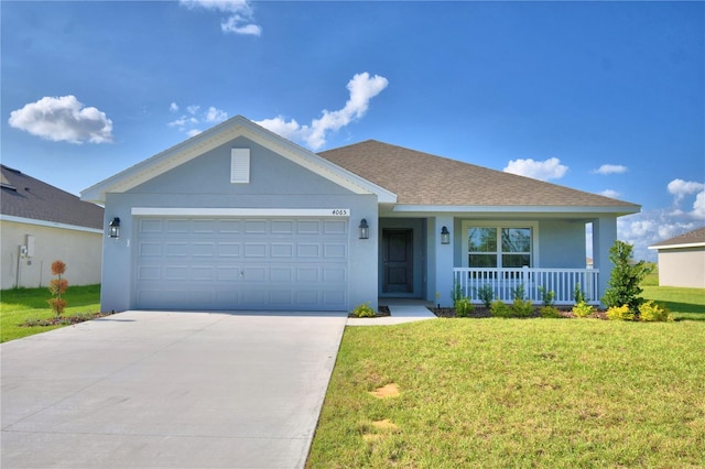 ranch-style home featuring covered porch, a garage, and a front lawn