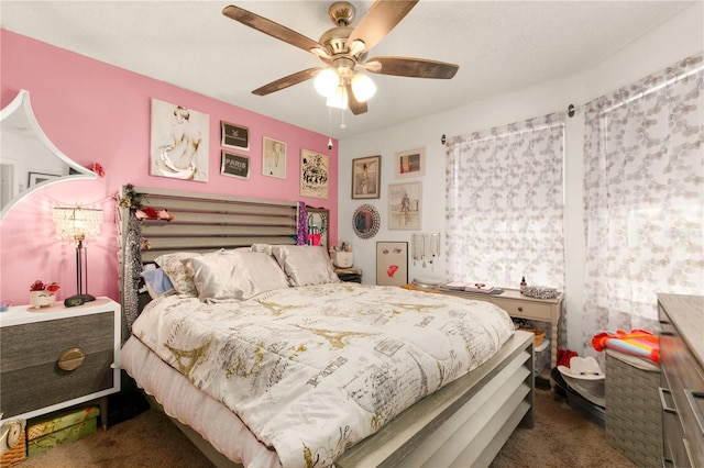 carpeted bedroom featuring ceiling fan